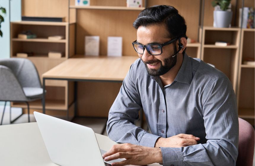Man on laptop for Boston Chamber DEI program