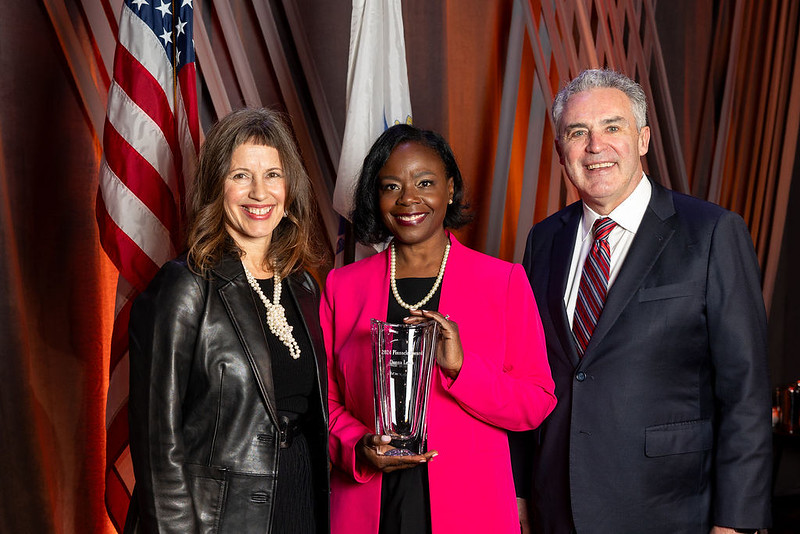 Susan Loconto Penta and James E. Rooney pose with 2024 Pinnacle Award Honoree, Donna Levin.