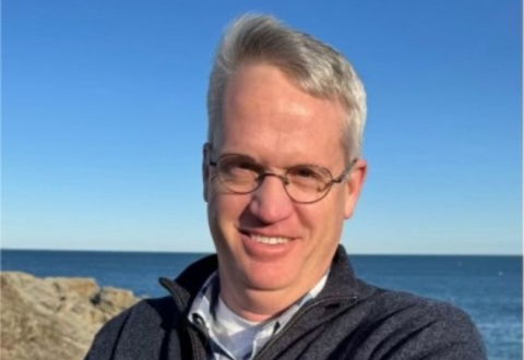 Headshot of Bill Freeman at the beach