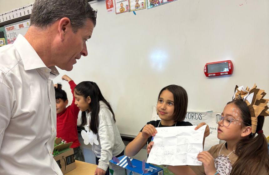 Business executive interacting with BPS students during Principal Partners event